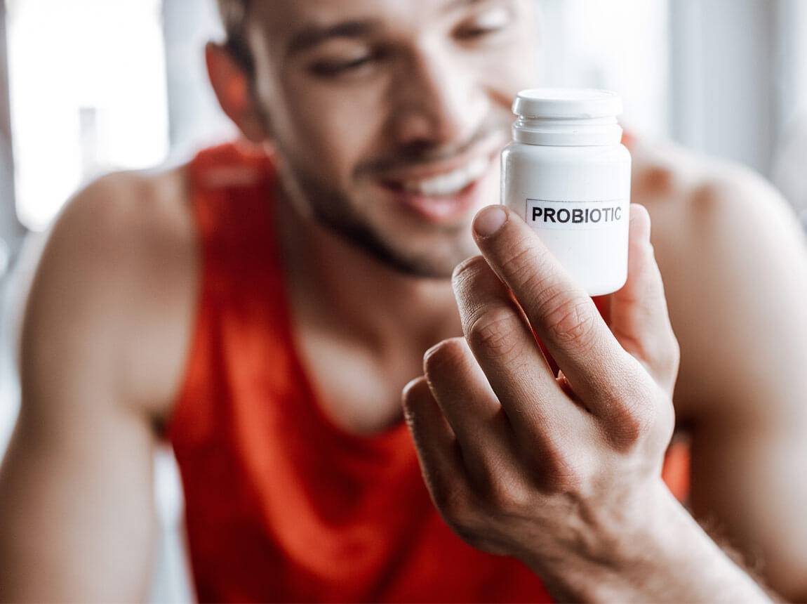 muž s probiotikom 